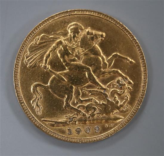 An Edward VII 1909 gold full sovereign.